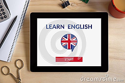 Online learn English concept on tablet screen with office object Stock Photo