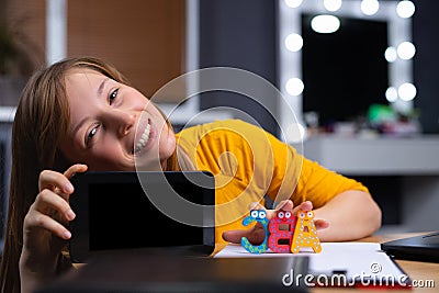 Online learning app. Caucasian pretty girl using smartphone application for study foreign languages, browsing in mock up mobile Stock Photo