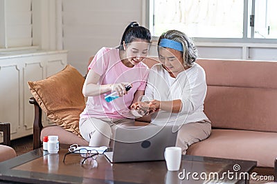 Online Learning how to prevent the coronavirus from laptop computer. Young Asian caregiver teach correct hand cleaning by Stock Photo