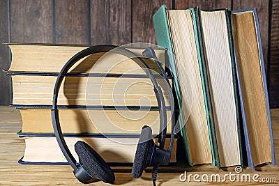 online learning, studing and teaching concept, books pile and laptop, remote education in coronavirus time, closeup Stock Photo
