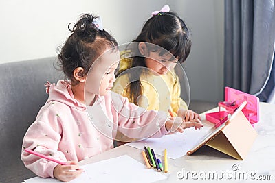 Online learning and teaching concept, Asian girl student study online with video call teacher happy young girl learning listen Stock Photo