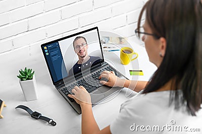 Online meeting with a teammate. The concept of working from home during an epidemic Stock Photo