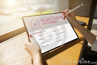 Online mortgage application on screen. Property loan. Business and financial concept. Stock Photo
