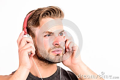 Online music services. Inspiring music concept. Man handsome unshaven hipster listening music using headphones gadget Stock Photo