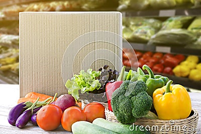 Online order grocery shopping concept. Food delivery ingredients service at home for cooking with packages box on wood table on Stock Photo