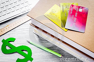 online pay for fee-paying education on gray student desk backgro Editorial Stock Photo