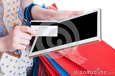 Online payment concept with tablet and debit card in close-up Stock Photo