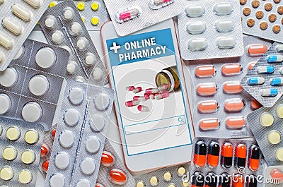 Online pharmacy. Application in your smartphone for online ordering of medicines. Lots of pills. The concept of Stock Photo