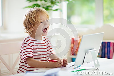 Online remote learning. School kids with computer Stock Photo