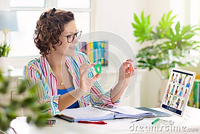 Online remote learning. Teacher with computer Stock Photo