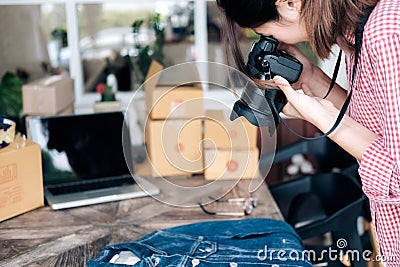 Online seller take a photo of product for upload to website online shop. Stock Photo