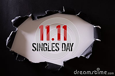 Online shopping of China, 11.11 singles day sale concept. Top view of Black torn paper and the text 11.11 singles day sale on a Stock Photo