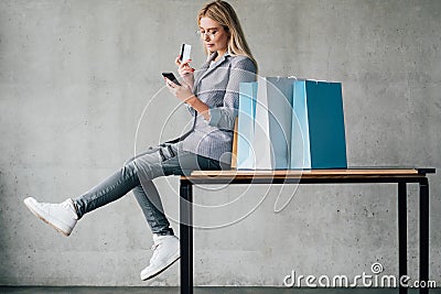 Online shopping credit card payment smartphone bag Stock Photo