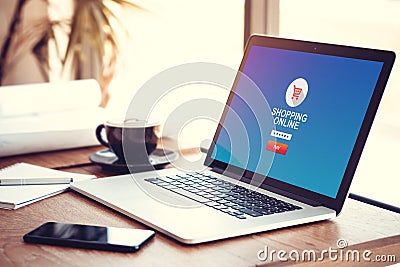 Online shopping website on computer laptop blue screen background Stock Photo