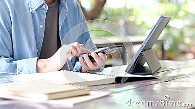 Online study class, Man hand student using mobile phone and digital tablet for e learing, Work from home, Social distancing concep Stock Photo