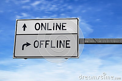 Online versus offline. White two street signs with arrow on metal pole. Directional road. Crossroads Road Sign, Two Arrow. Stock Photo