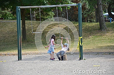 Children play on a closed Toronto public playground during the Covid-19 Pandemic. Editorial Stock Photo