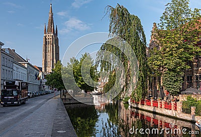 Onze Lieve Vrouw cathedral tower along Dijver, Bruges, Belgium Editorial Stock Photo
