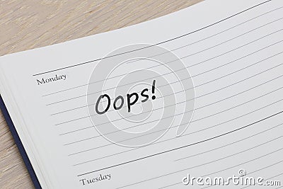 Oops diary reminder appointment open on desk Stock Photo