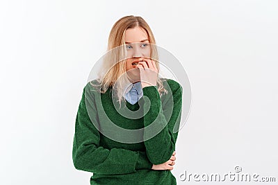 Oops. Embarrassed young woman horrified facial expression made big mistake feel guilty, bite lips fingers, wear casual clothes. Stock Photo