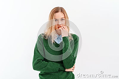 Oops. Embarrassed young woman horrified facial expression made big mistake feel guilty, bite lips fingers, wear casual clothes. Stock Photo