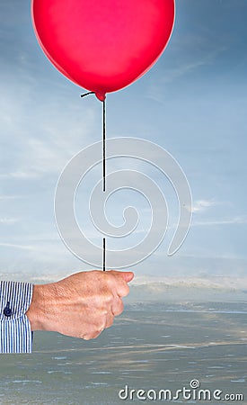 Oops. Hand with balloon on broken string. Concept. Stock Photo