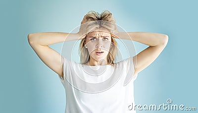 Oops I have big troubles facial expression. Portrait of woman clutching her head with two hands Stock Photo