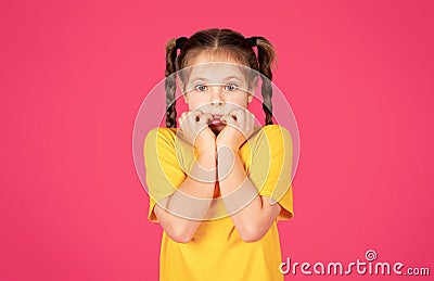 Oops. Portrait Of Shocked Little Girl Touching Face And Looking At Camera Stock Photo
