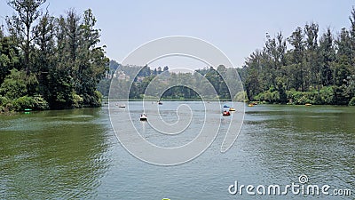 Boating in ooty lake. Artificial lake in the Nilgiris district of Tamil Nadu, India. Major scenic tourist attraction with Paddle, Stock Photo