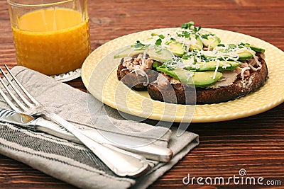 Open avocado sandwiches with tuna on whole grain bread Stock Photo