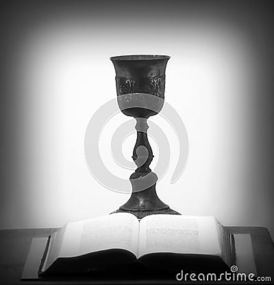 Open Bible and Grail Goblet Stock Photo