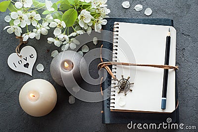 Open blank journal with blossom Stock Photo