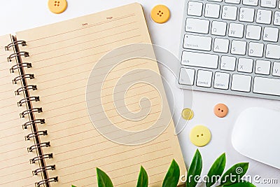 Open blank notebook with computer keyboard and mouse. Top view w Stock Photo