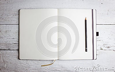 Open blank notepad with empty pages with a pencil Stock Photo