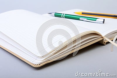 Open Blank Page notebook and pen on white table. Stock Photo