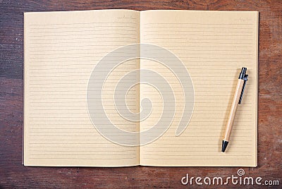 Open blank school notebook or diary, old fashioned, on wooden desk, space for text, top view Stock Photo
