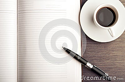 Open a blank white notebook, pen and coffee on the desk Stock Photo