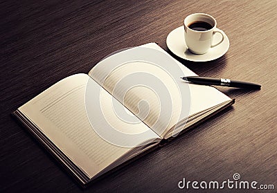 Open a blank white notebook, pen and coffee on the desk Stock Photo