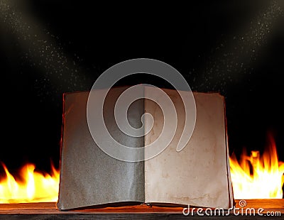 Open book in ambient light with fire Stock Photo