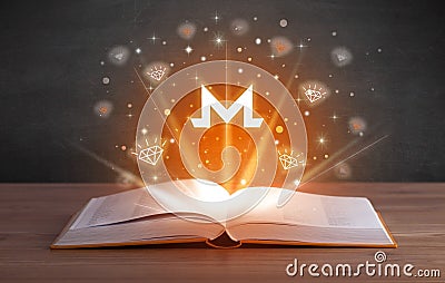 Open book with currency icons above Editorial Stock Photo