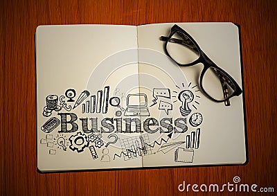 Open book with glasses and black business doodles on table Stock Photo