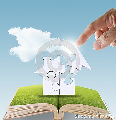 Open book of hand complete puzzle home Stock Photo