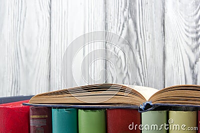 Open book, hardback books on wooden background. Back to school. Copy space Stock Photo