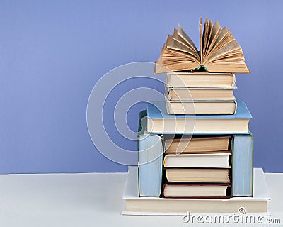 Open book, hardback colorful books on wooden table. Back to school. Copy space for text. Education business concept Stock Photo