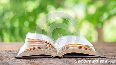 Open book outdoor. Selective focus.Opened book on bright background Stock Photo