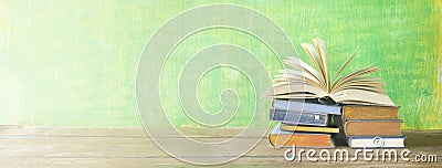 Open book on a stack of books, Stock Photo