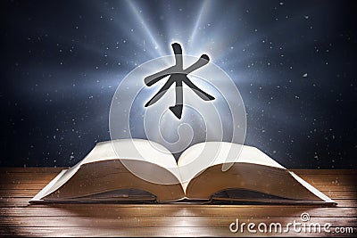 Open book on wooden table and confucianism symbol front view Stock Photo