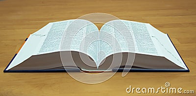 An open book on a wooden table Stock Photo