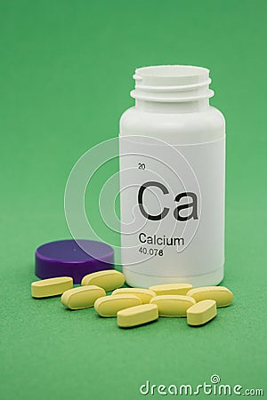 Open bottle of Calcium vitamins Stock Photo