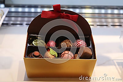 Open box of chocolates Stock Photo